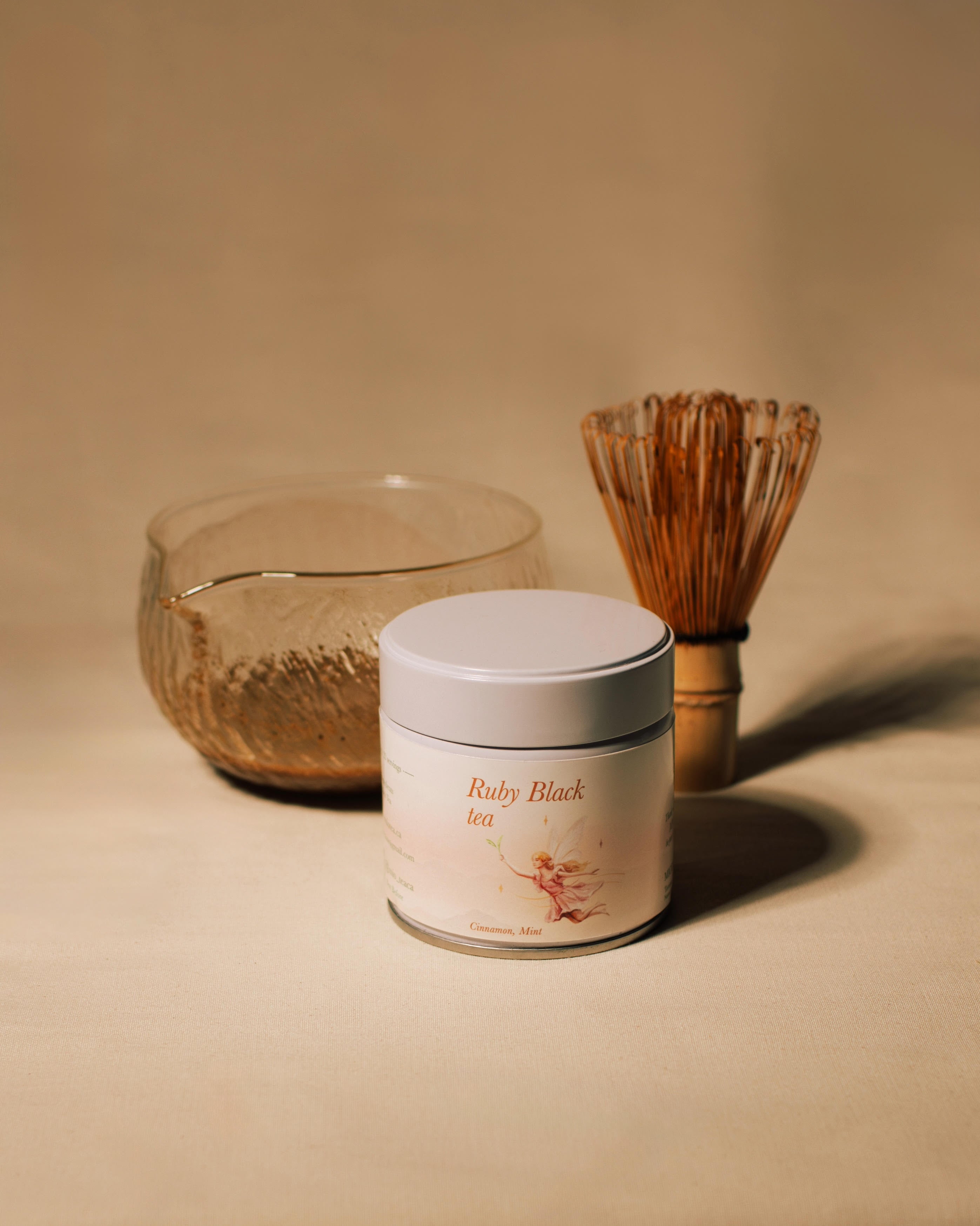 Ruby Black Tea Powder tin with tea bowl and bamboo whisk. 